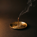Solid brass incense tray with lit stick